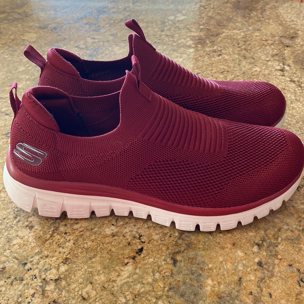 Sketchers light weight memory foam shoes. Only wore in house and too Wide for me